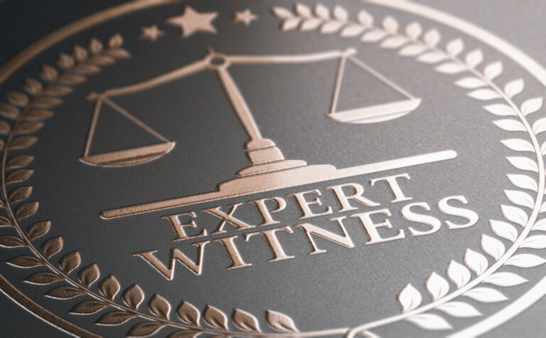 3D illustration of a golden stamp where it is written the text expert witness