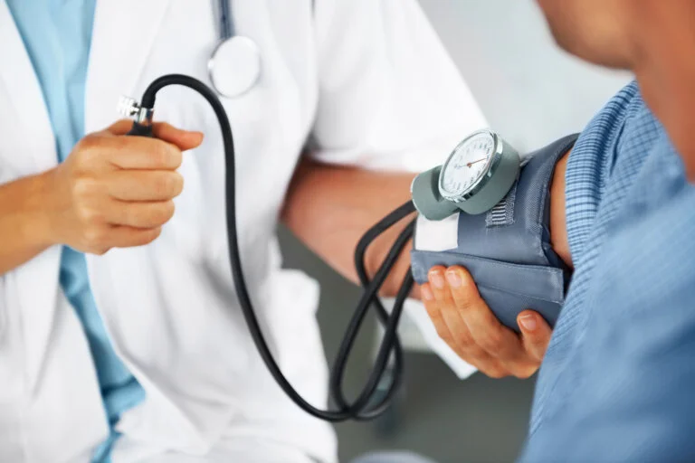 Blood pressure cuff on a patient's arm