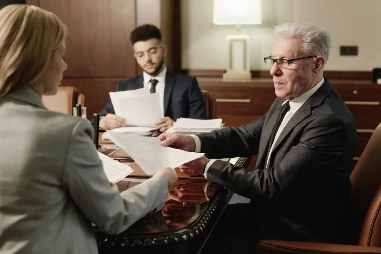 Group of attorneys reviewing an expert witness